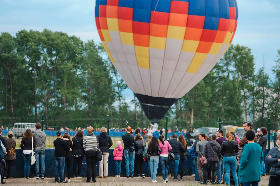 Fly in an airplane or hot air balloon